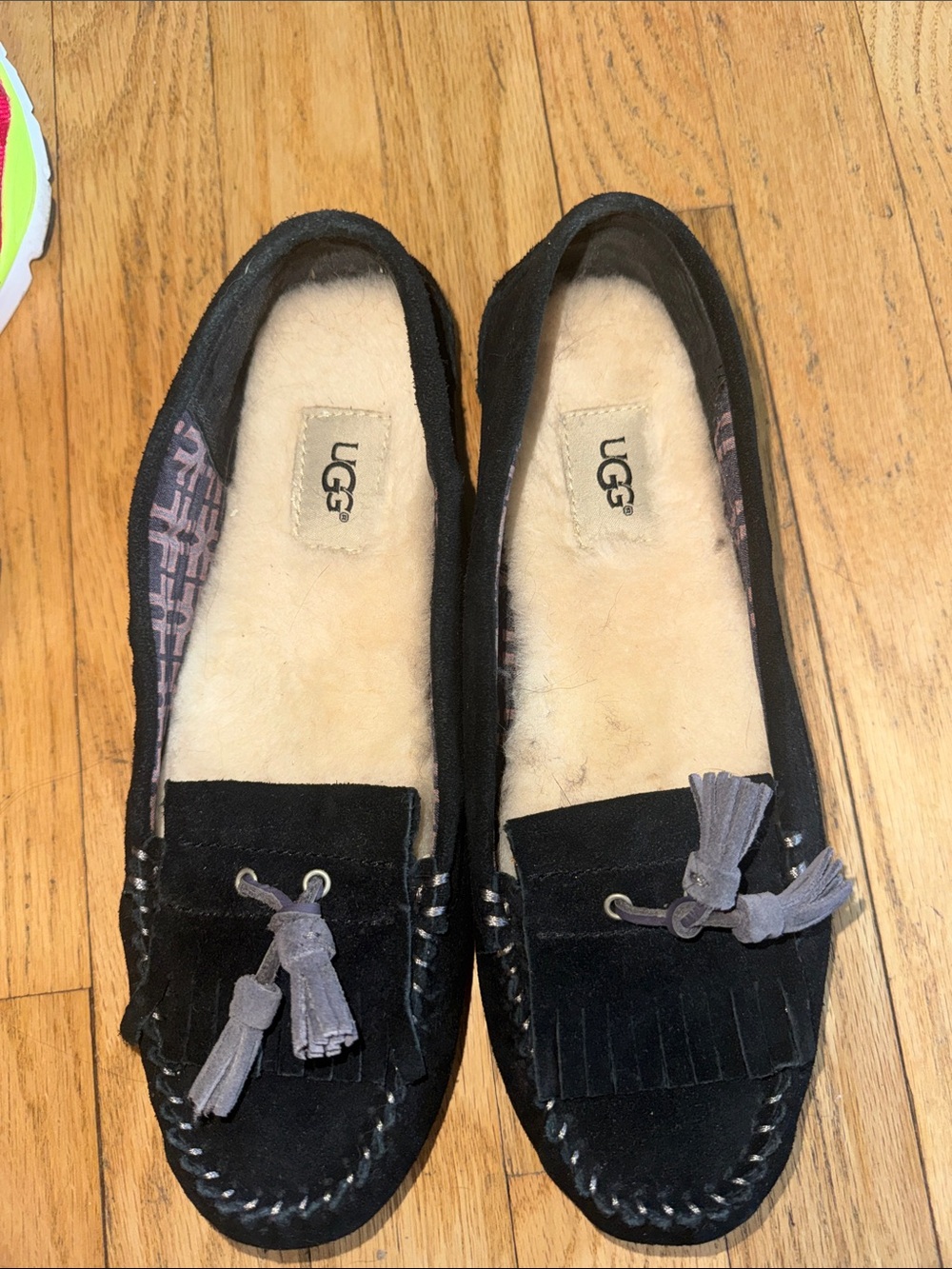 UGG Women's Black Suede Tassel Moccasins with Shearling Lining